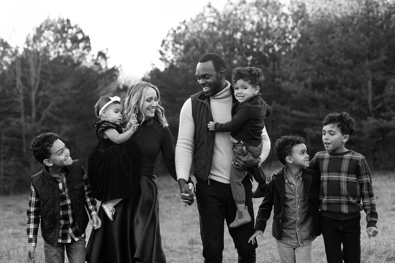 family of seven during fall walking in Birmingham Park in Milton