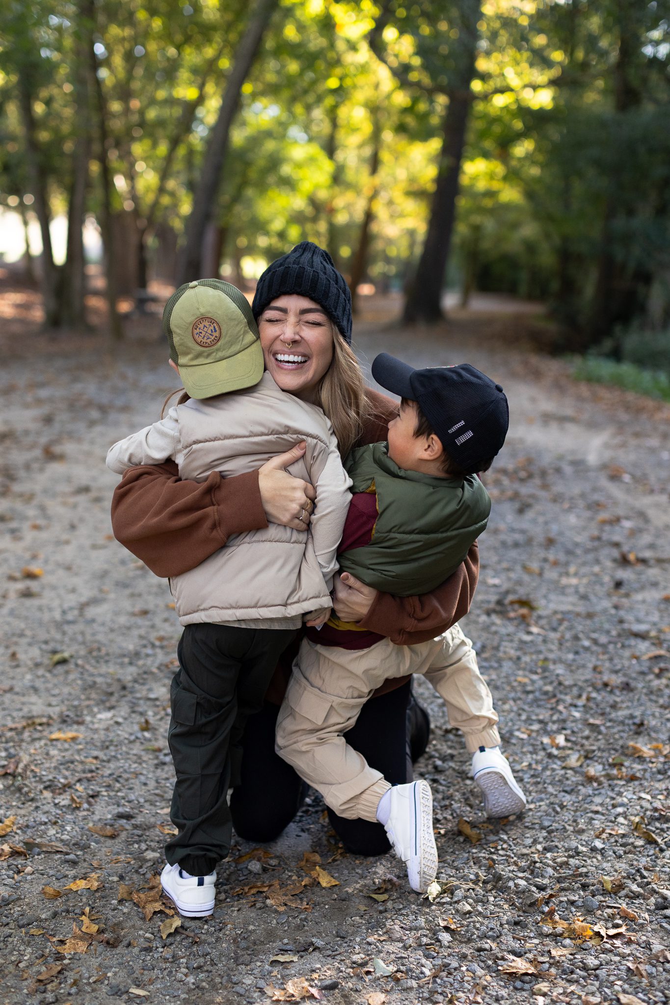 twin boys run to mom during fall on Oxbo Trail in Roswell