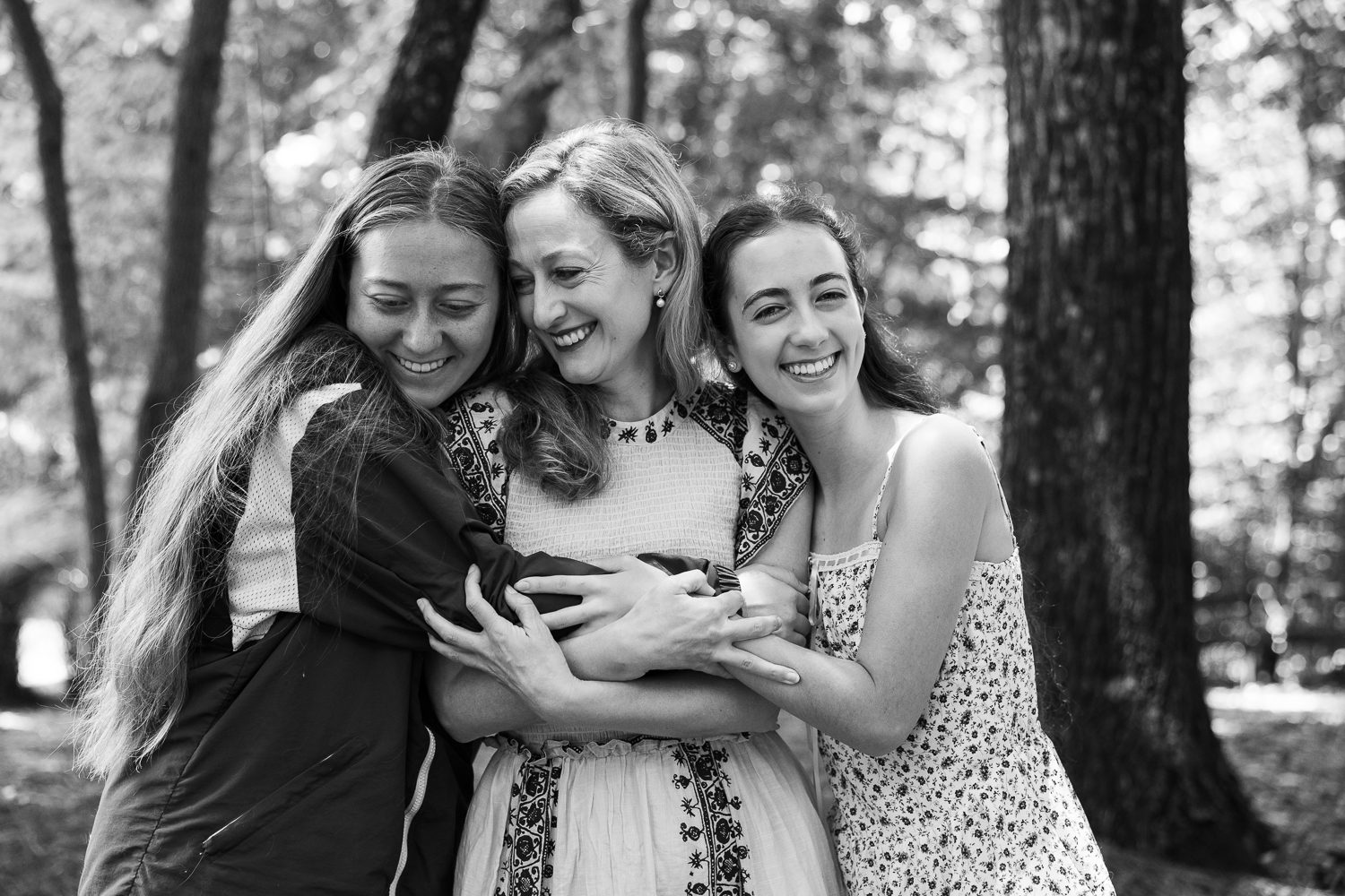 Sisters and Mom hugging together during Atlanta family photography session