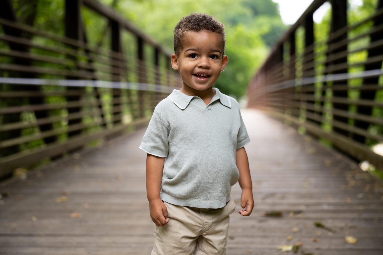 Smiling toddler portrait on bridge during Brookhaven family photography session